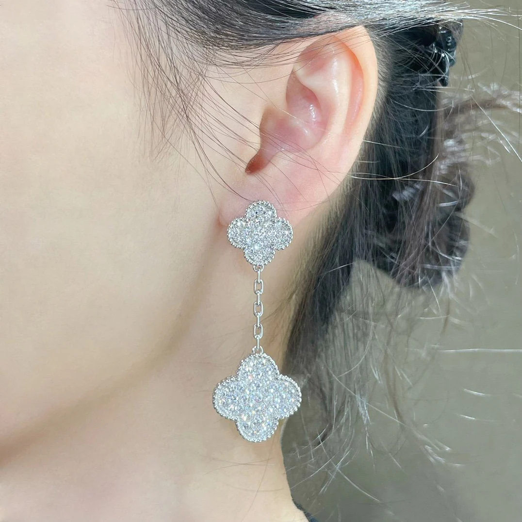 13339742334556112_84d49a1a-97bd-4e04-bd5d-e39aa7cd3985.webp CLOVER 2 MOTIFS DIAMOND PAVED SILVER EARRINGS - Image 1
